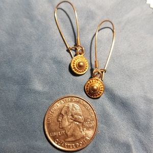 Gold colored dangle earrings